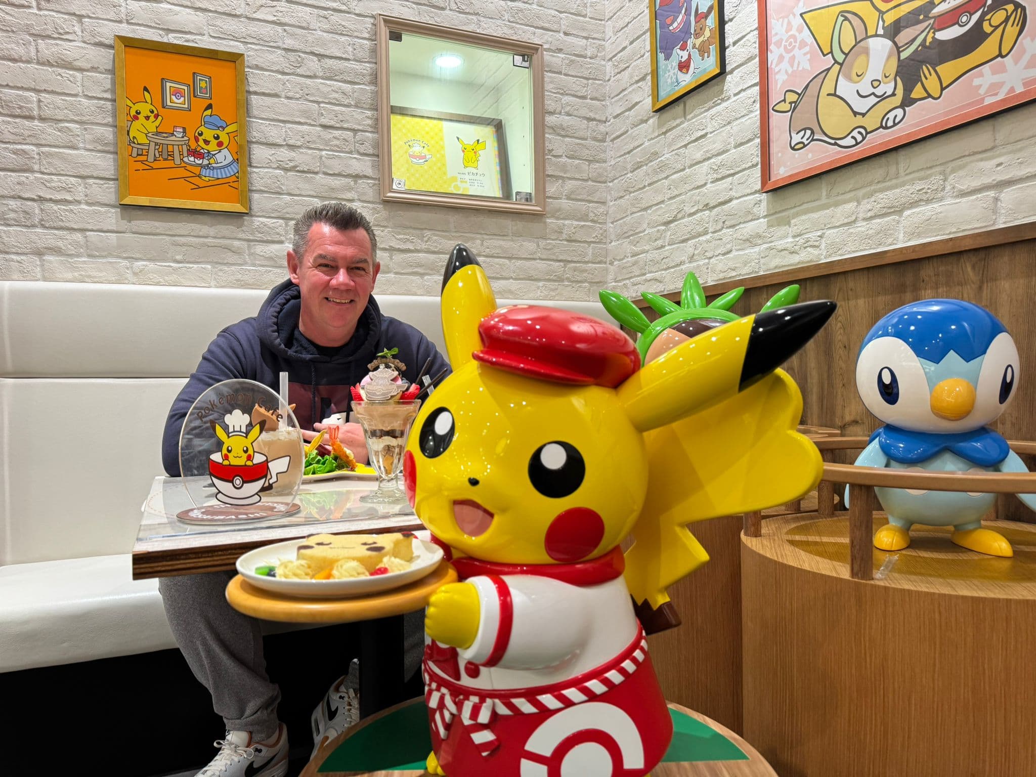 Luke scoping out a pokemon cafe in Japan