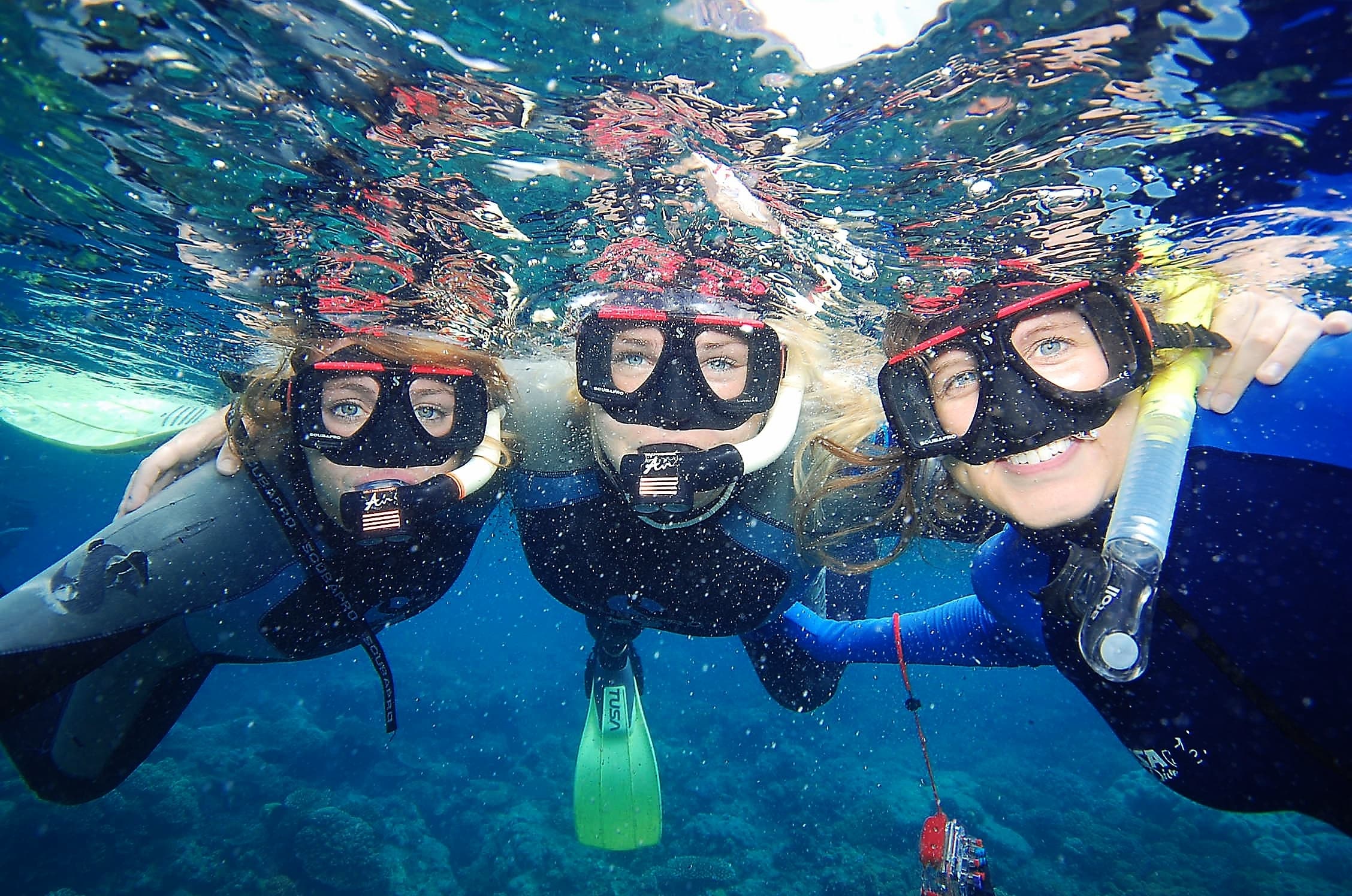 Girls snorkeling on a Small World Journeys trip